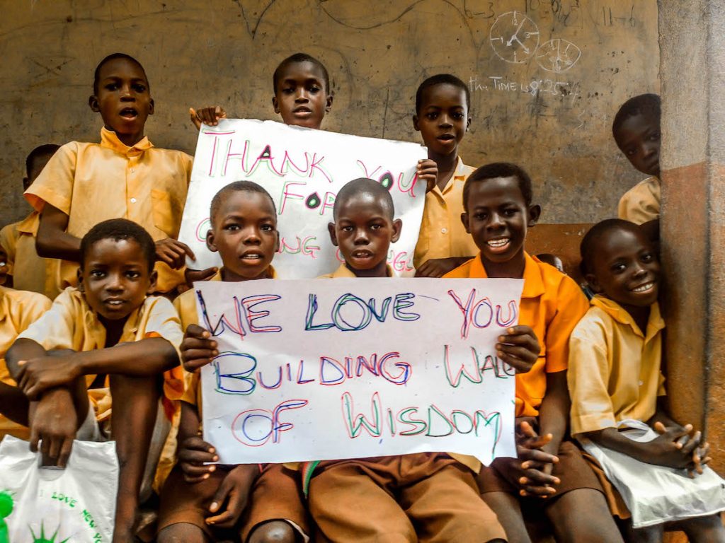 students-from-kpduuli-primary-showing-sign-post_